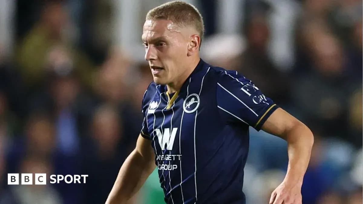 Player in Millwall kit running during match Player in Millwall kit running during match