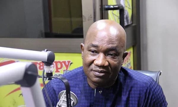 Person speaking during a radio broadcast session Person speaking during a radio broadcast session