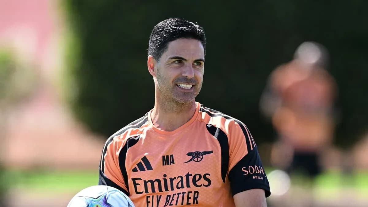 Manager holding a ball during training session Manager holding a ball during training session