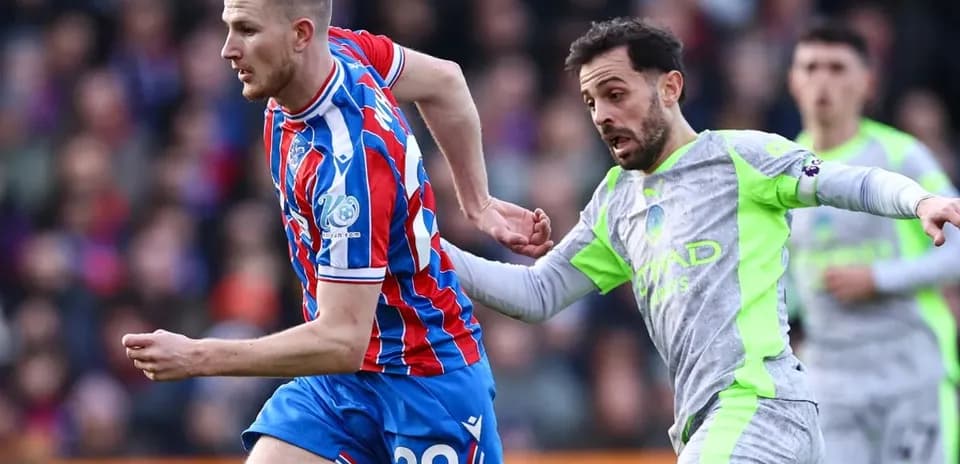 Crystal Palace player chased by Manchester City player Crystal Palace player chased by Manchester City player