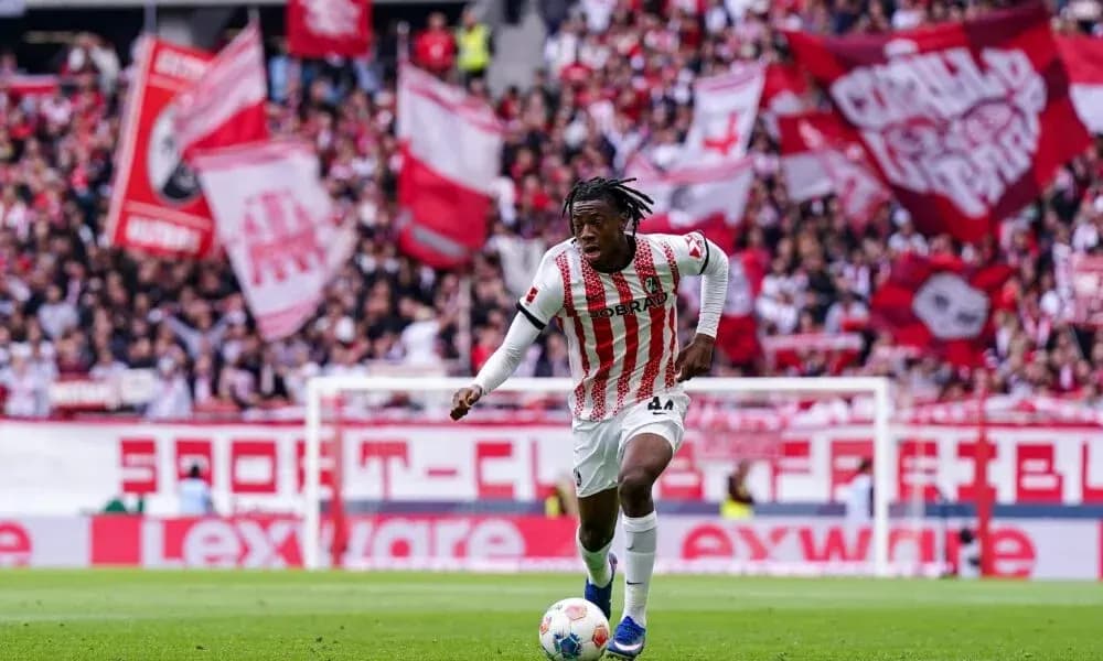 Player running with the ball in front of fans Player running with the ball in front of fans
