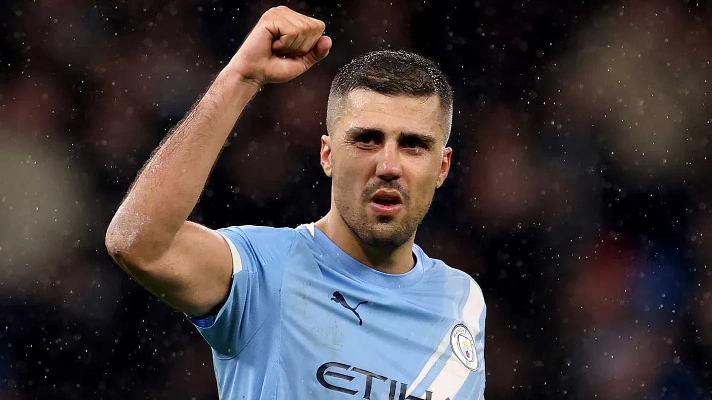 Player celebrating with raised fist in Manchester City kit Player celebrating with raised fist in Manchester City kit
