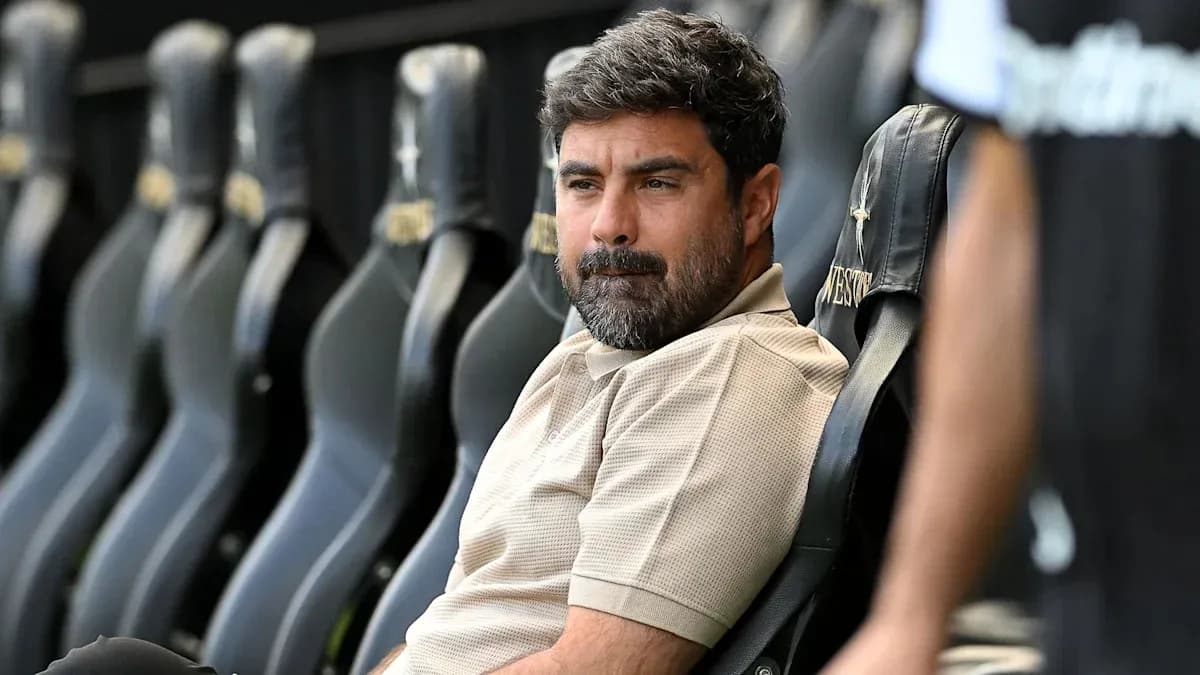 Coach seated on bench during match preparations Coach seated on bench during match preparations