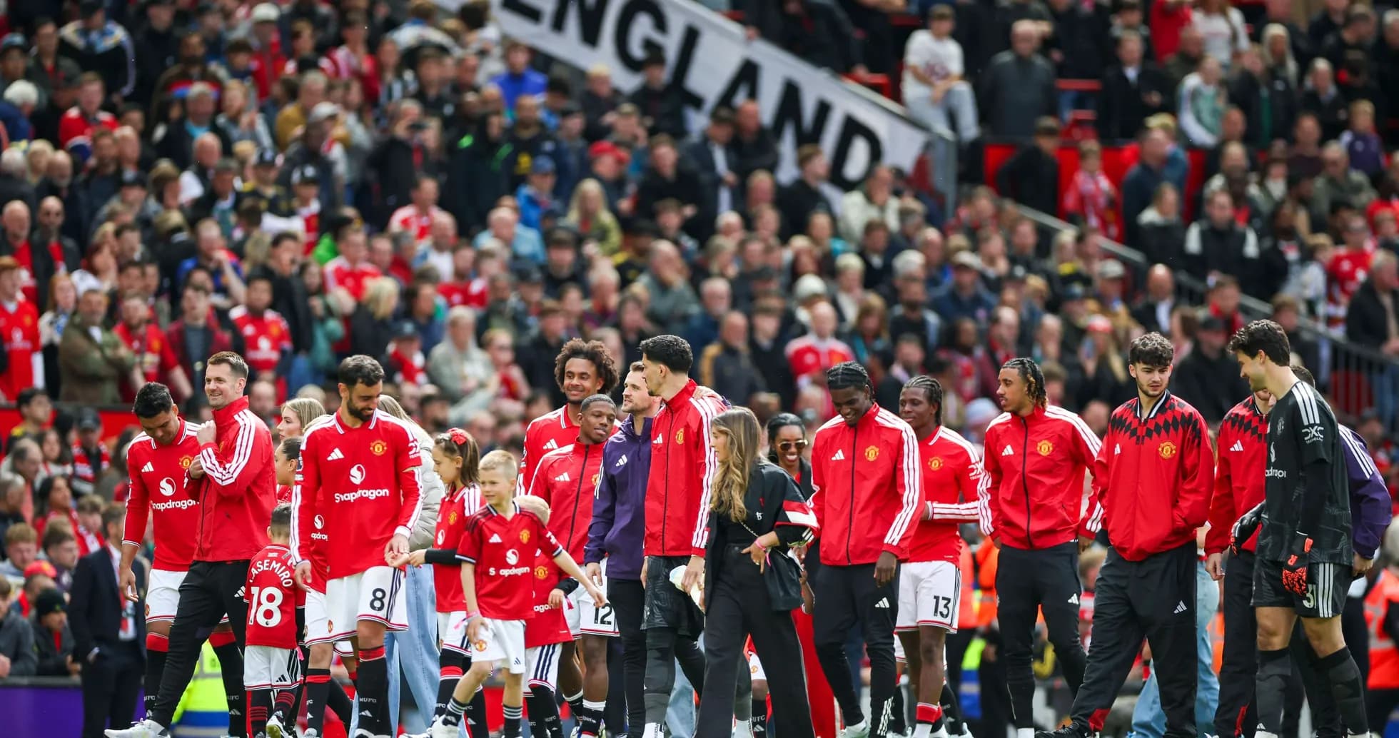 Manchester United players entering the field with fans Manchester United players entering the field with fans