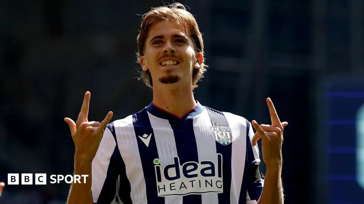Player celebrating with hand gestures in team jersey Player celebrating with hand gestures in team jersey