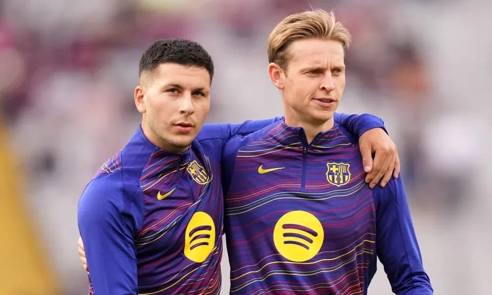 Two players in FC Barcelona training attire posing together Two players in FC Barcelona training attire posing together