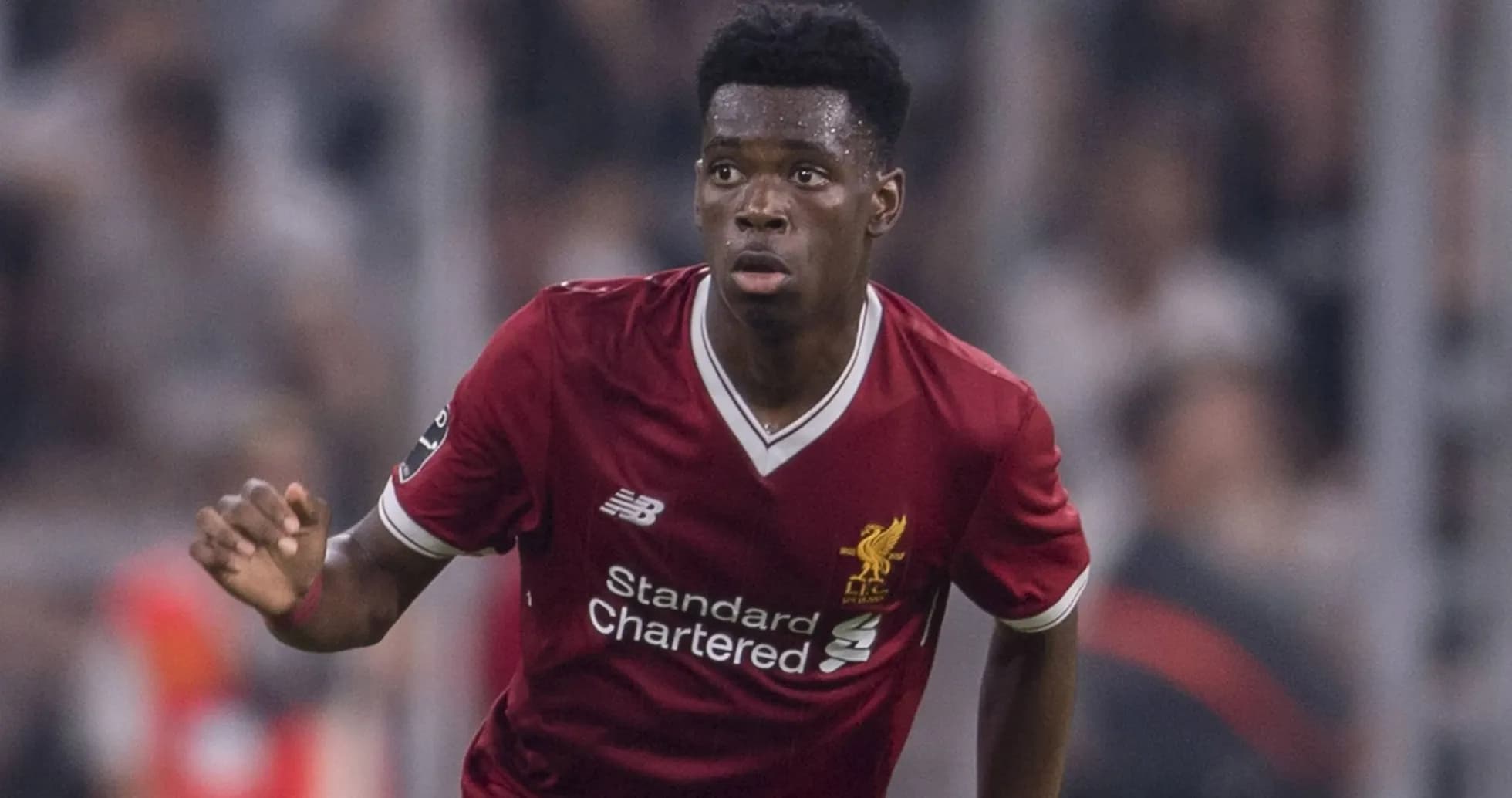 Player running during a Liverpool FC match Player running during a Liverpool FC match