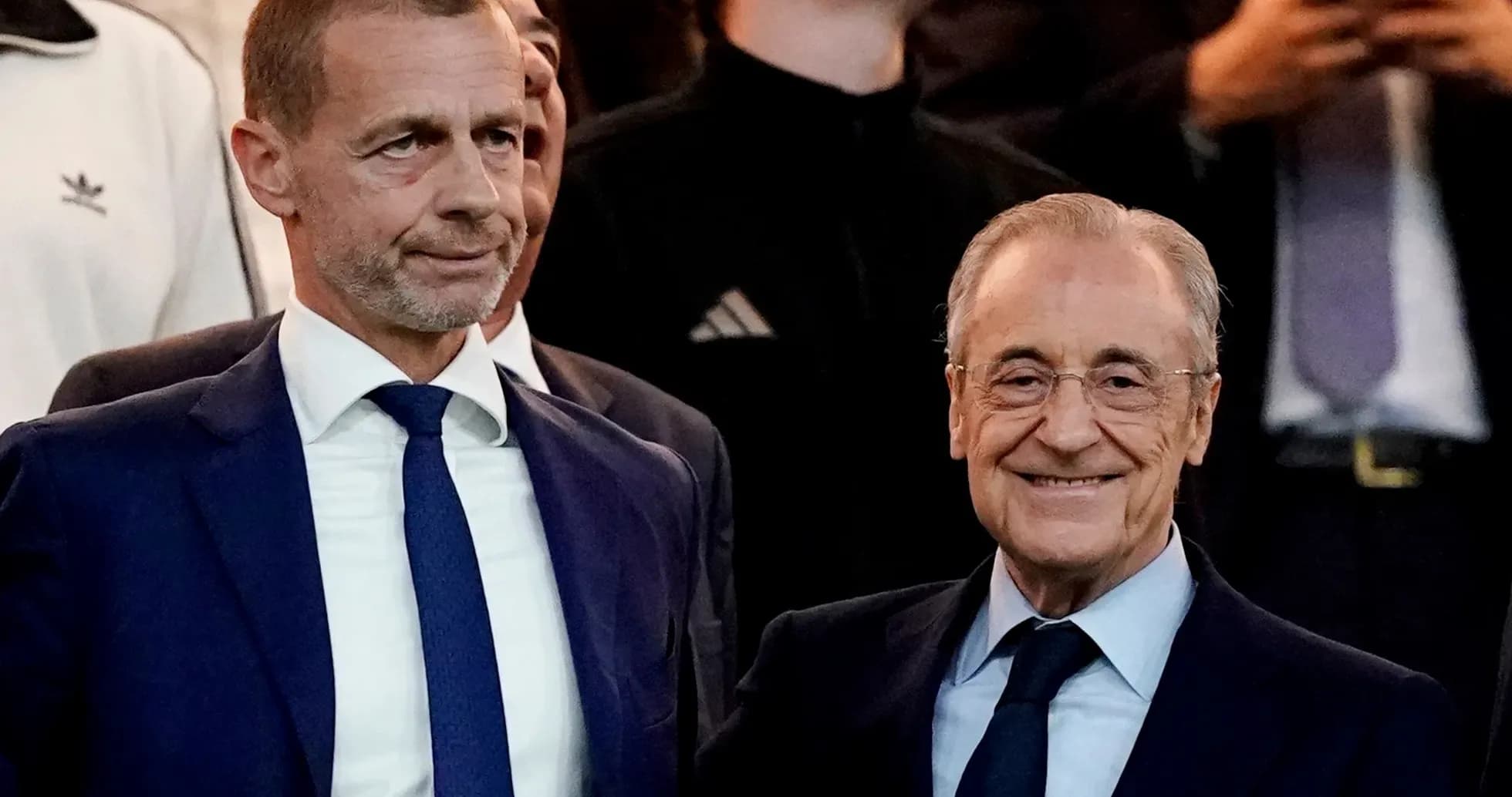 Two executives posing together at an event Two executives posing together at an event