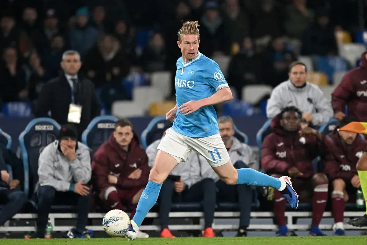 Player in light blue kit running with ball Player in light blue kit running with ball