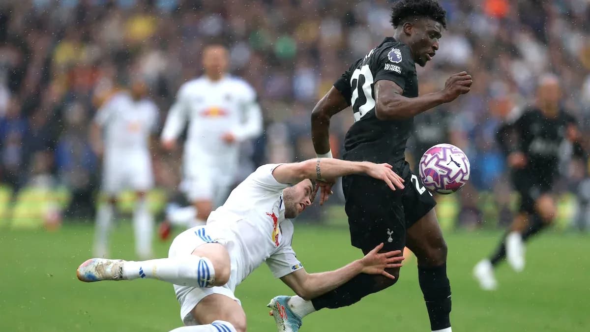 Player evading tackle during Premier League match Player evading tackle during Premier League match