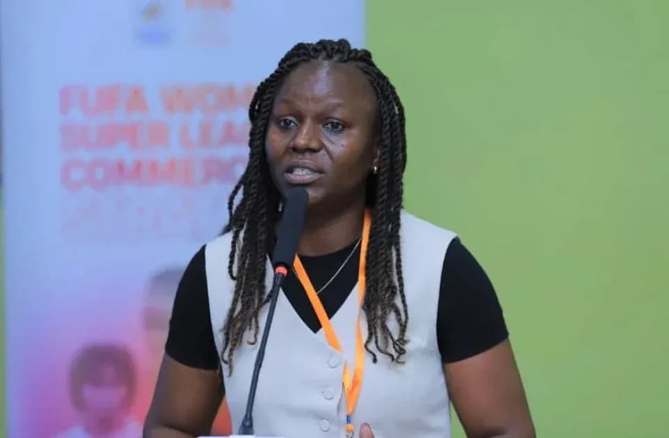 Woman speaking at FUFA Women Super League event Woman speaking at FUFA Women Super League event