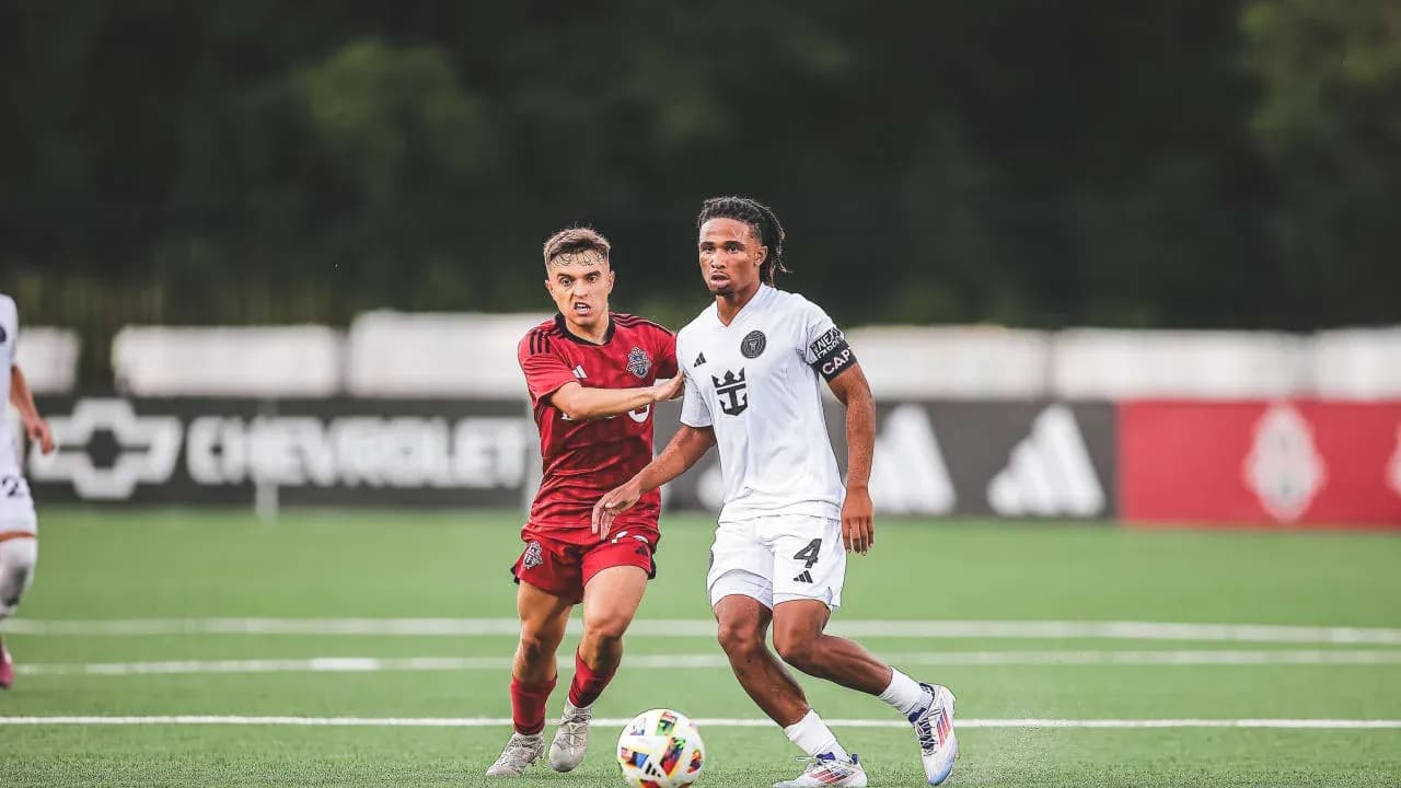 Inter Miami II player dribbling against Toronto II opponent Inter Miami II player dribbling against Toronto II opponent