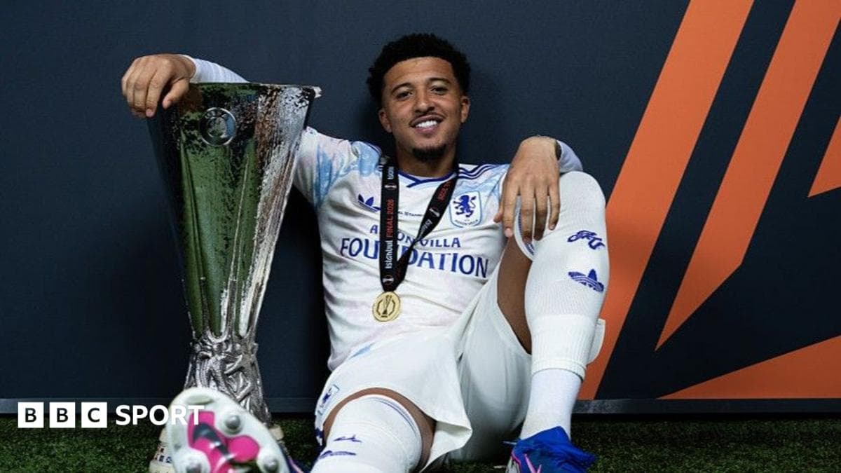 Player celebrating with trophy after match victory Player celebrating with trophy after match victory