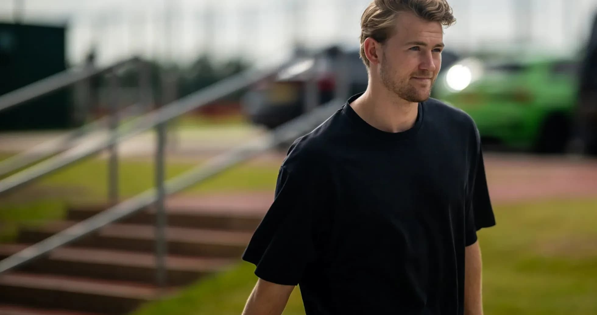 Player walking towards training facility outdoors Player walking towards training facility outdoors