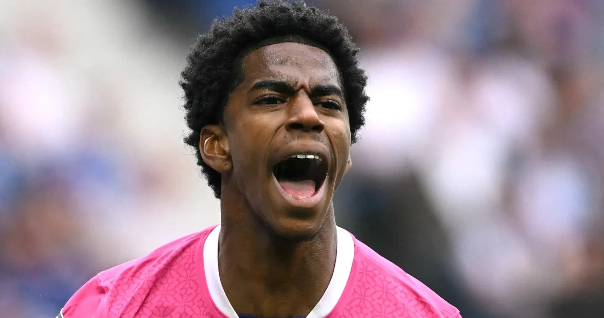 Player shouting while wearing a pink jersey Player shouting while wearing a pink jersey