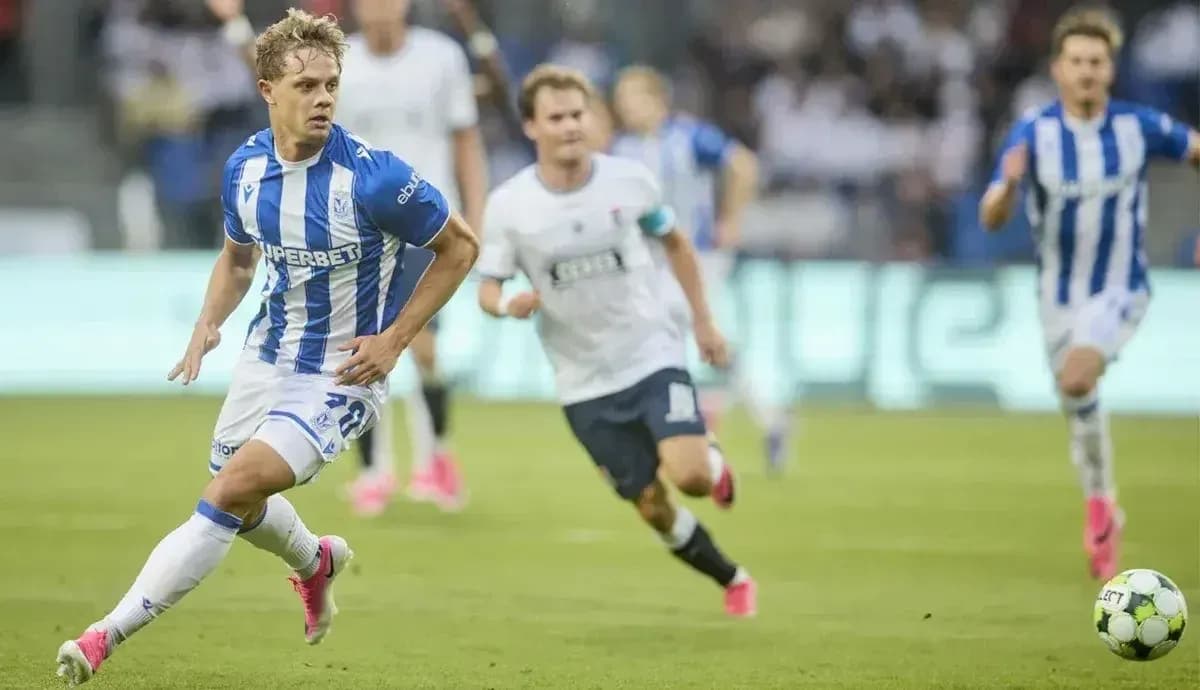 Lech Poznan player dribbling the ball during match Lech Poznan player dribbling the ball during match