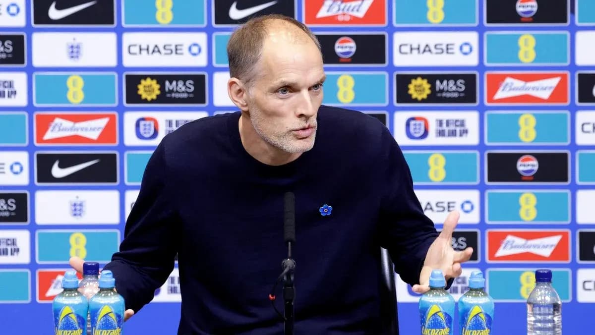 Coach speaking at press conference with water bottles Coach speaking at press conference with water bottles