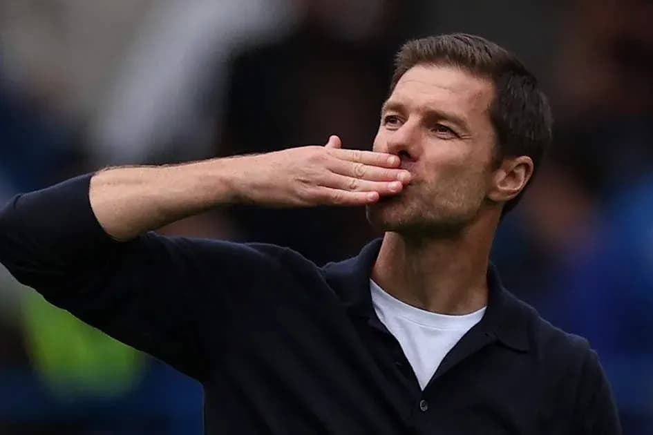 Coach blowing a kiss to fans during match Coach blowing a kiss to fans during match