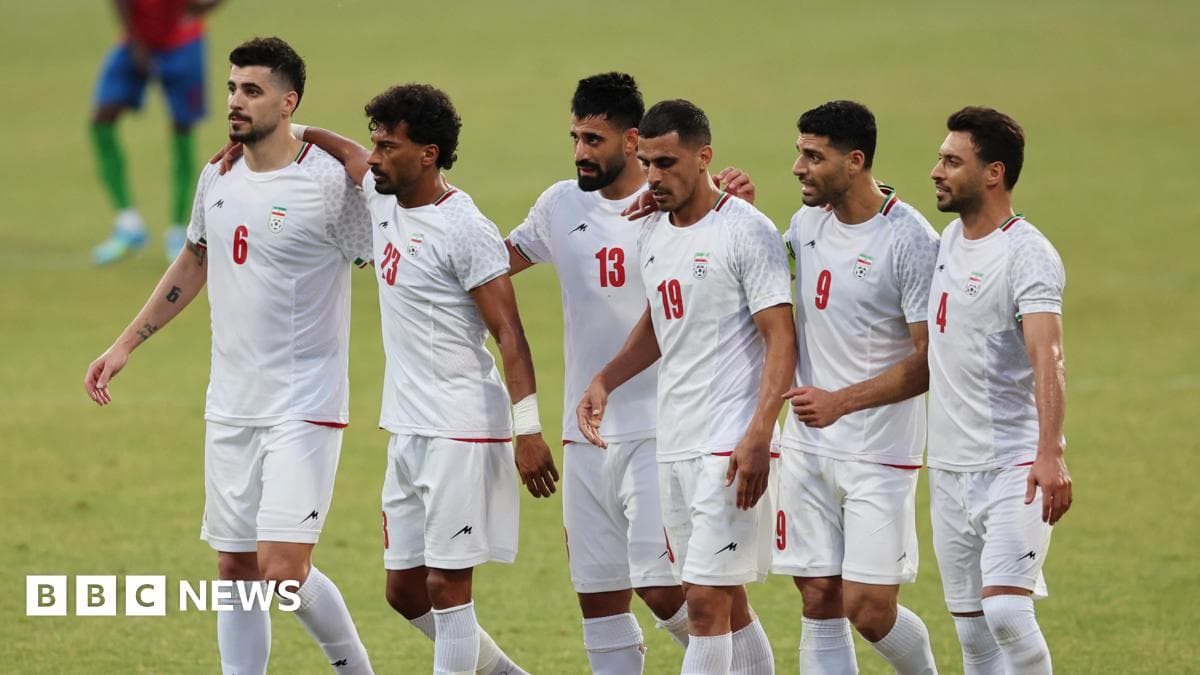 Iranian football players walking together on field Iranian football players walking together on field