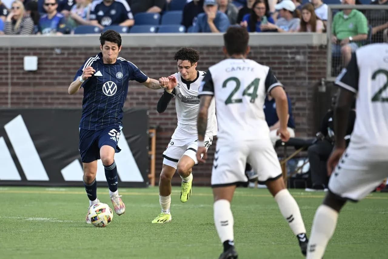 Player dribbling the ball during Chattanooga match Player dribbling the ball during Chattanooga match