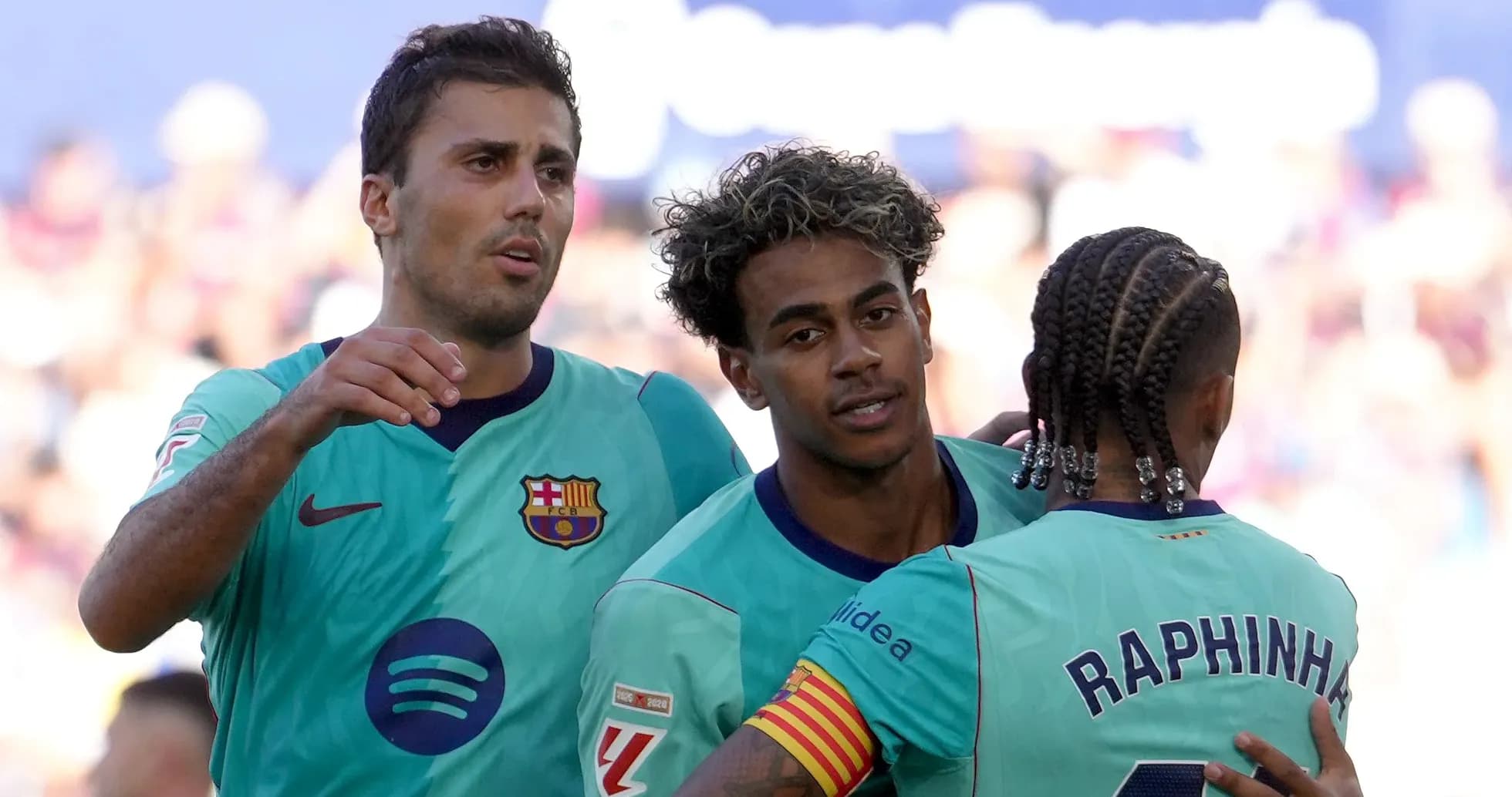 Barcelona players celebrating a goal together on field Barcelona players celebrating a goal together on field