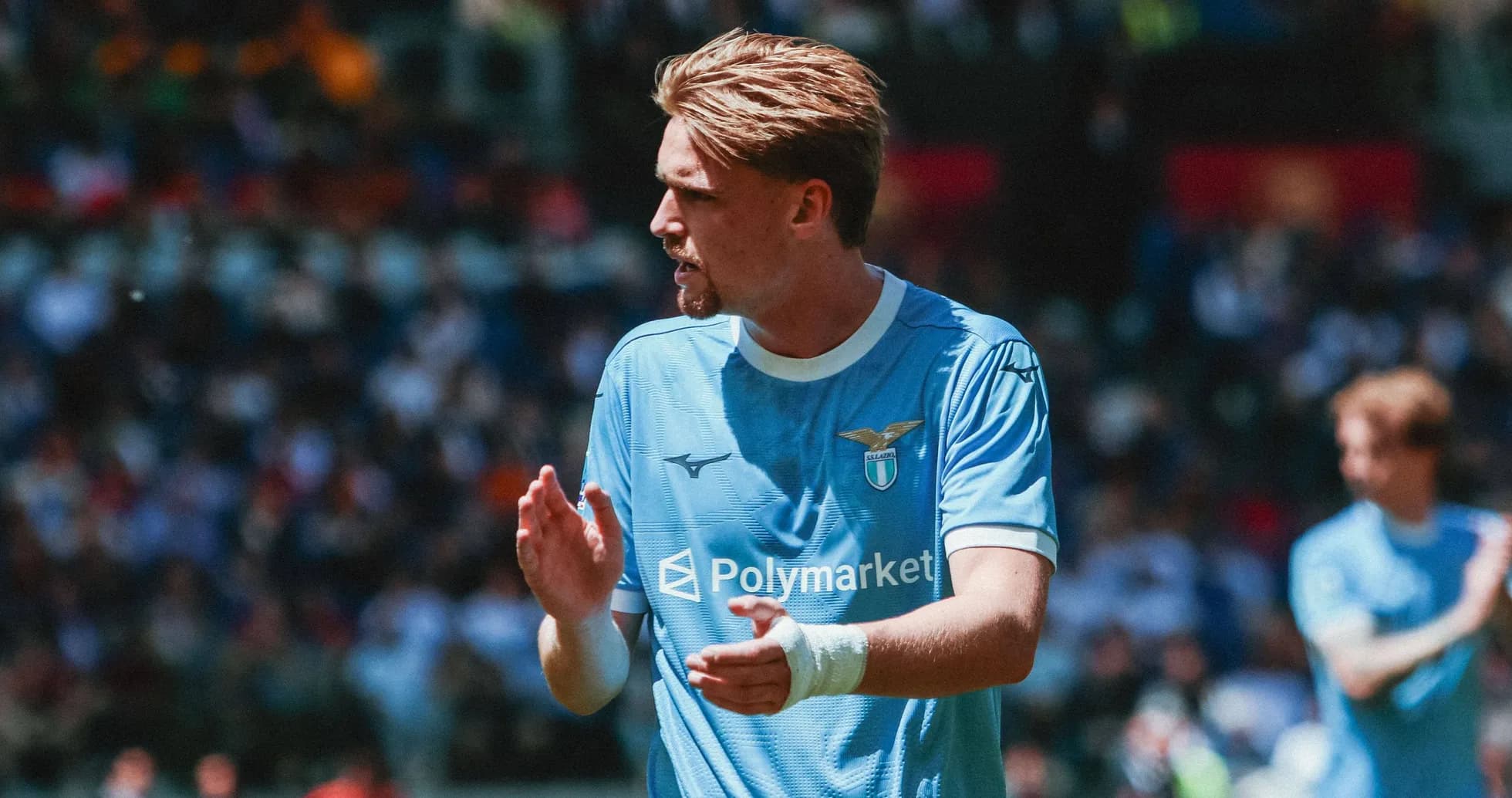 Lazio player clapping during match in blue kit Lazio player clapping during match in blue kit