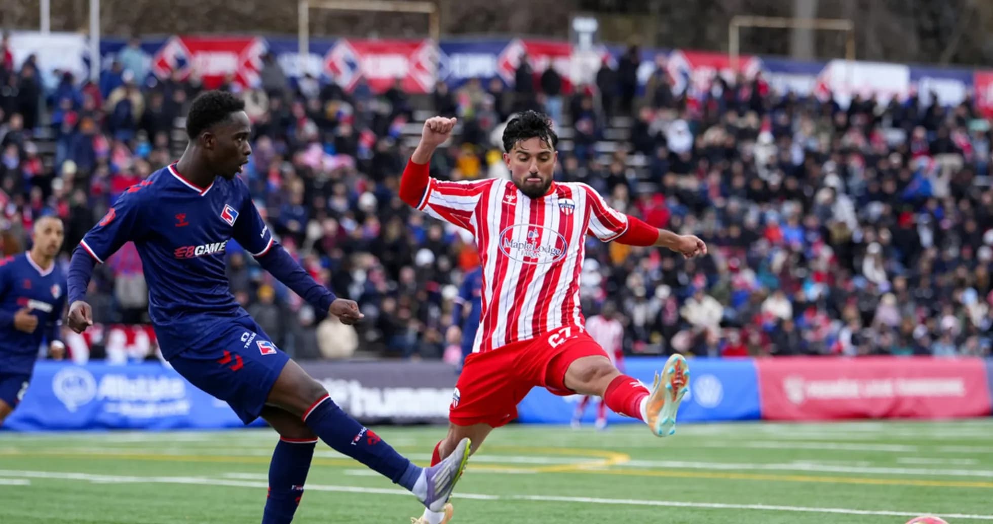 Atlético Ottawa player kicking the ball Atlético Ottawa player kicking the ball