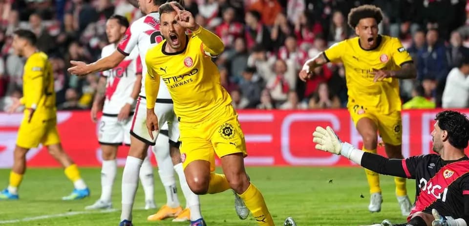 Players celebrating a goal during a match Players celebrating a goal during a match
