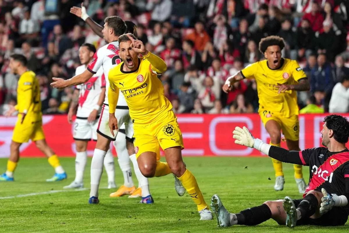 Players celebrating a goal during a match Players celebrating a goal during a match