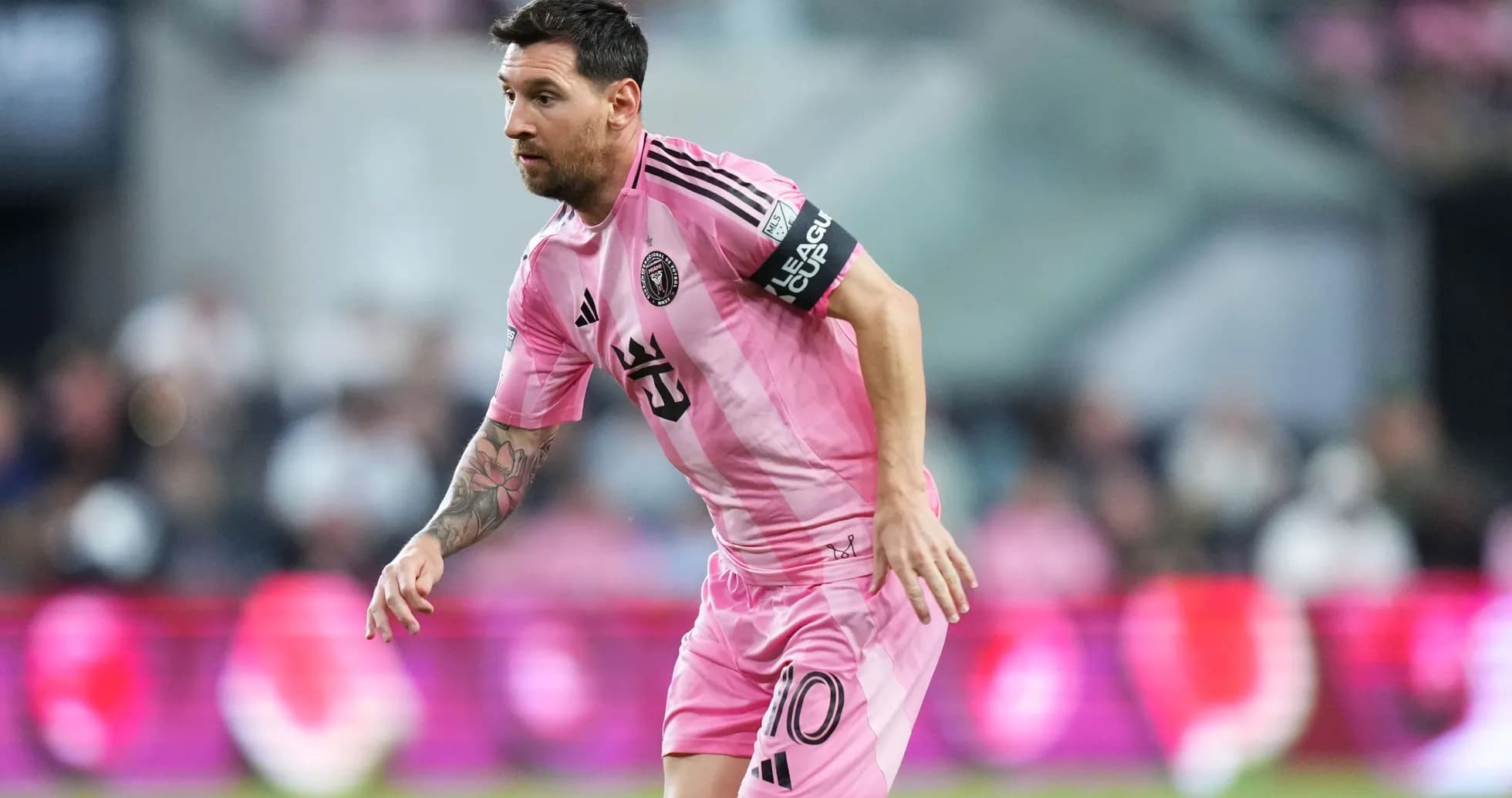 Player in pink jersey running on the field Player in pink jersey running on the field