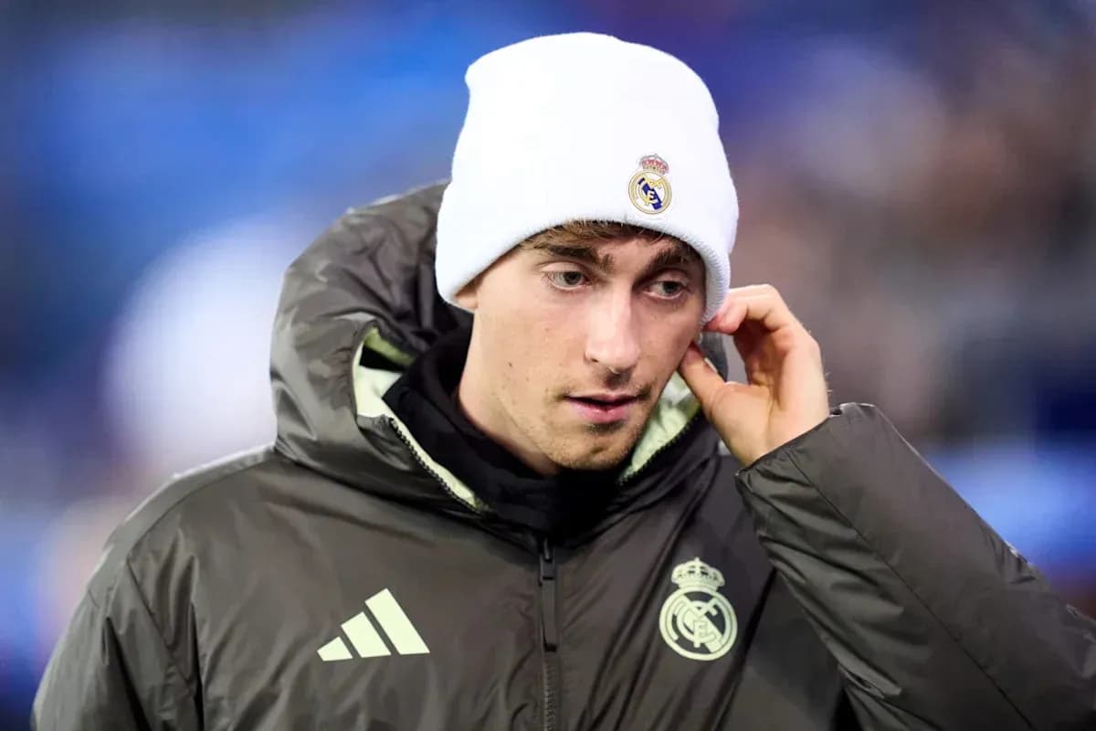 Player in Real Madrid jacket and beanie before match Player in Real Madrid jacket and beanie before match
