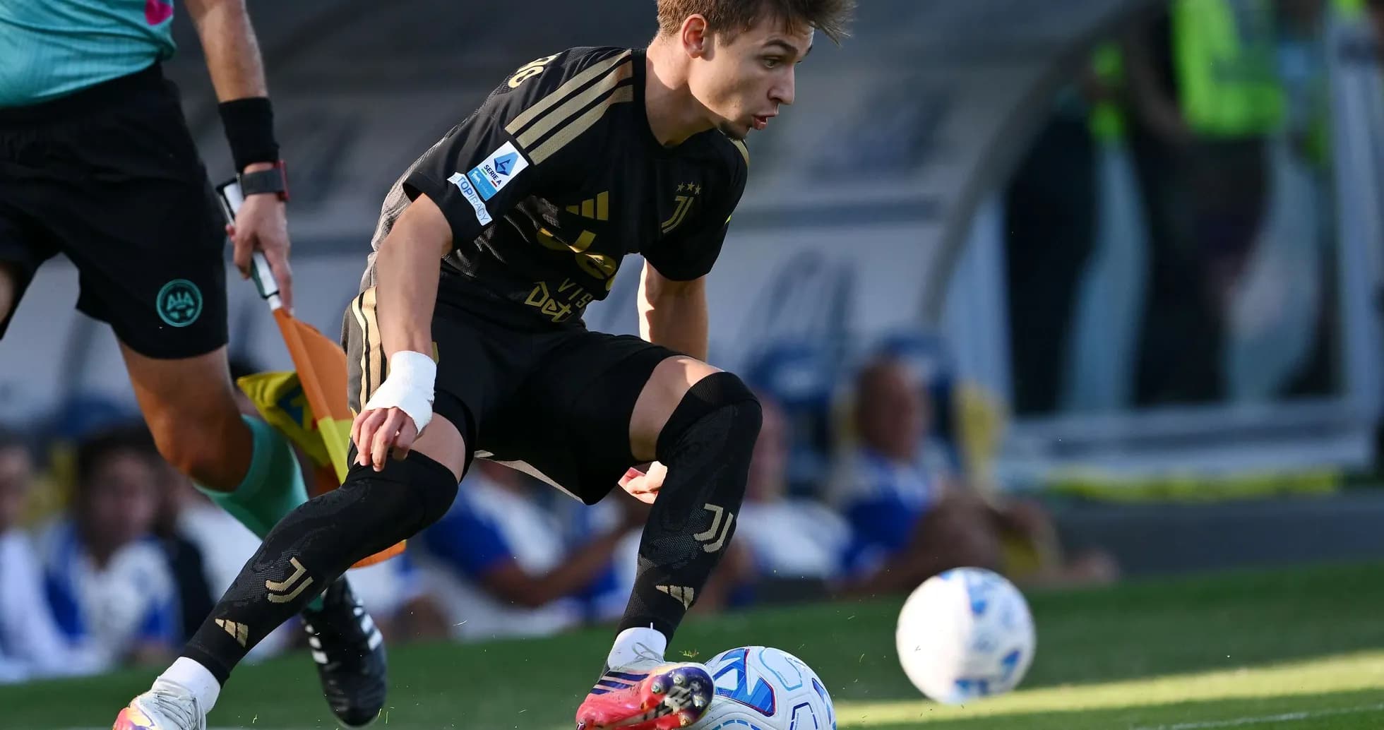 Juventus player dribbling the ball during match Juventus player dribbling the ball during match