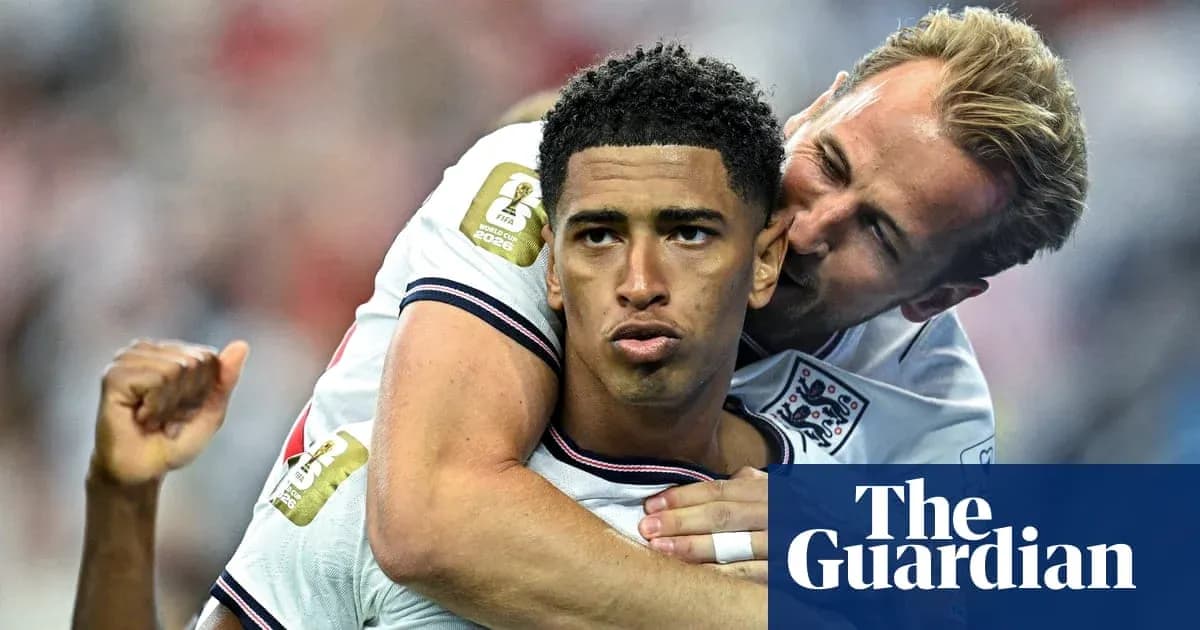 Two England players celebrating a goal together Two England players celebrating a goal together