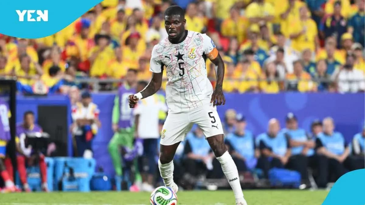 Ghana player in action during a football match Ghana player in action during a football match