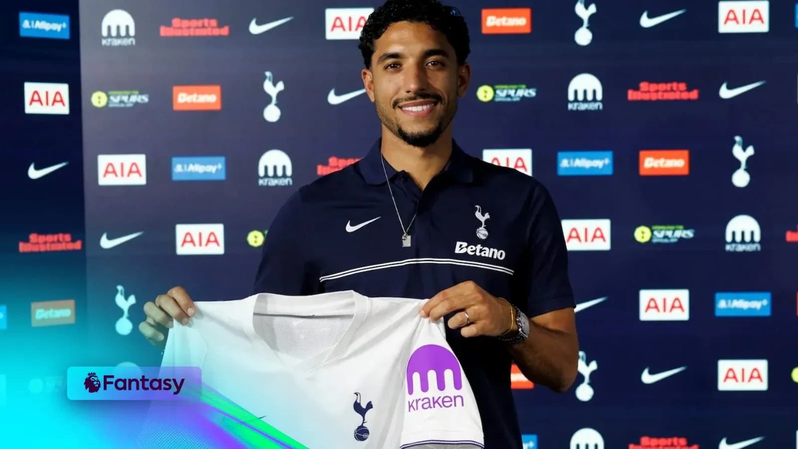 Player holding Tottenham Hotspur jersey at announcement Player holding Tottenham Hotspur jersey at announcement