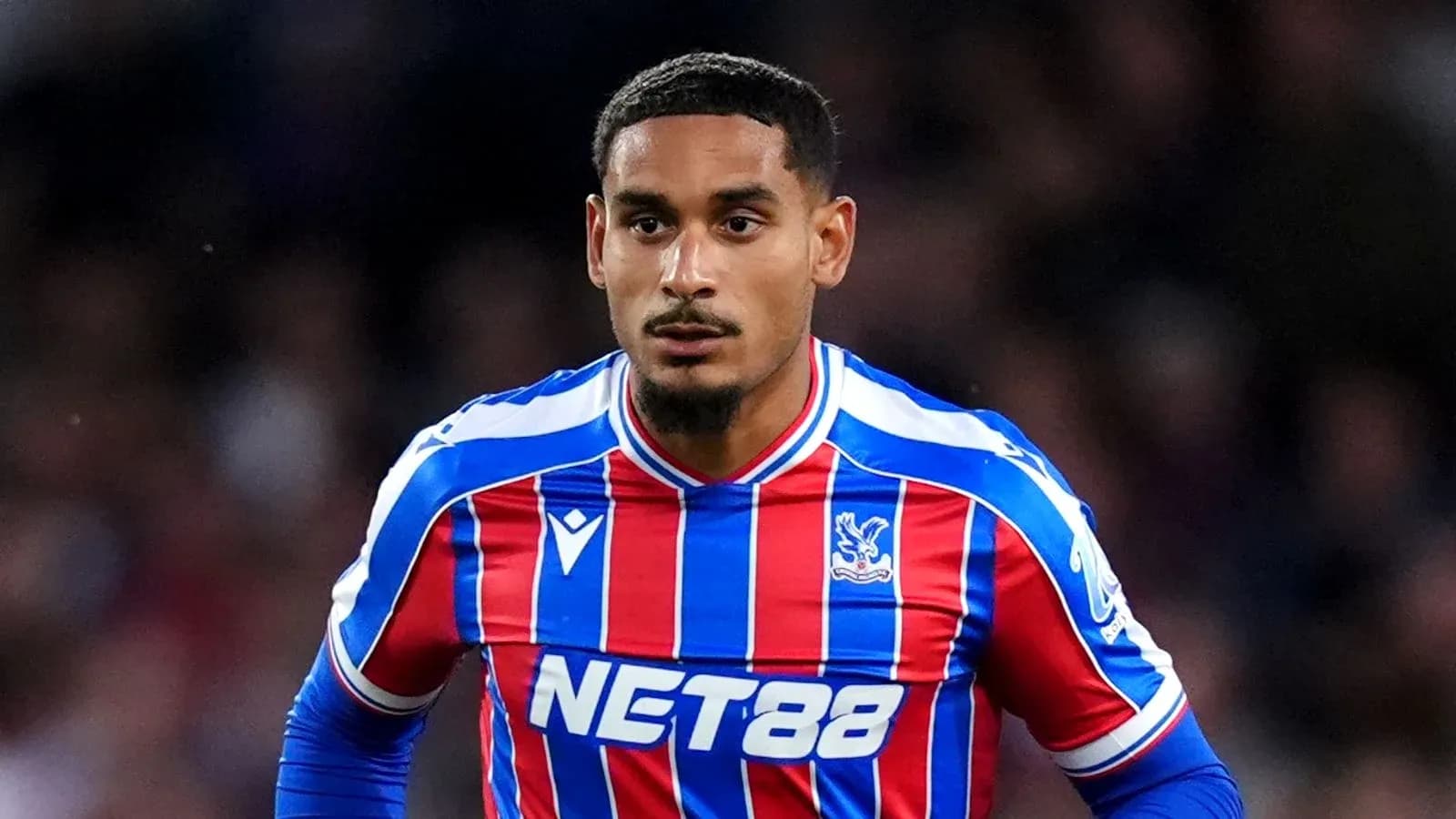 Player in Crystal Palace kit during match action Player in Crystal Palace kit during match action