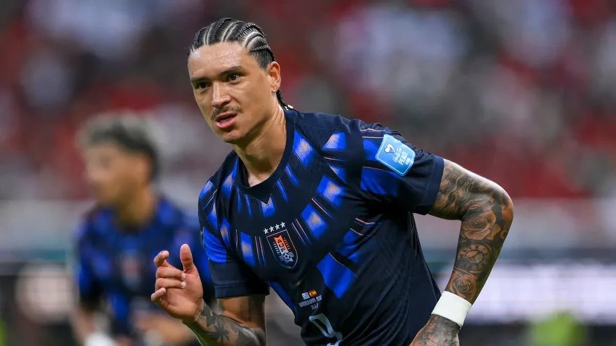 Player in blue jersey running during football match Player in blue jersey running during football match