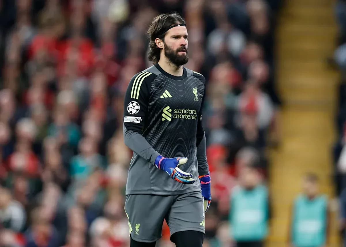 Goalkeeper in Liverpool kit walking on the pitch Goalkeeper in Liverpool kit walking on the pitch