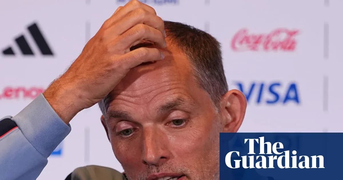 Coach speaking during press conference with hand on head Coach speaking during press conference with hand on head