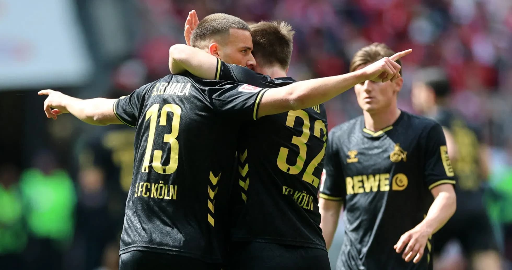 FC Köln players celebrating a goal together FC Köln players celebrating a goal together