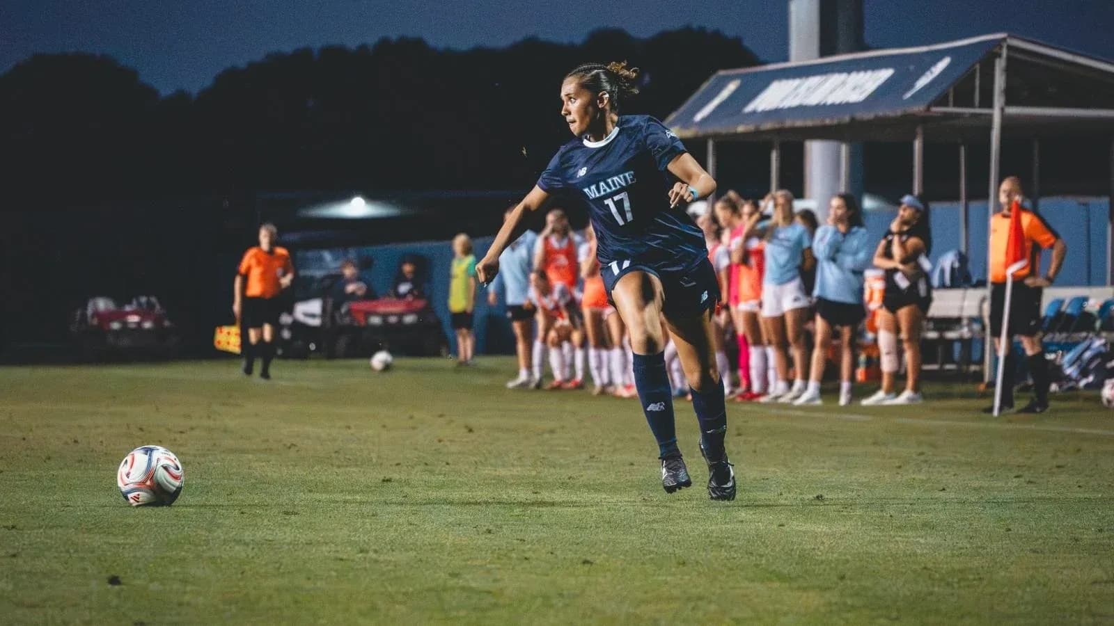 Player from Maine taking a corner kick during match Player from Maine taking a corner kick during match