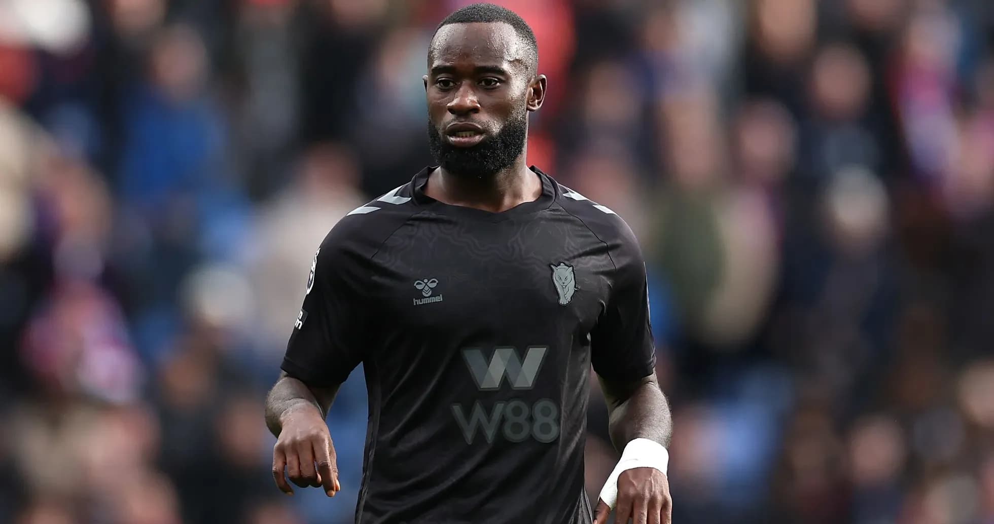 Player in black kit during match action Player in black kit during match action