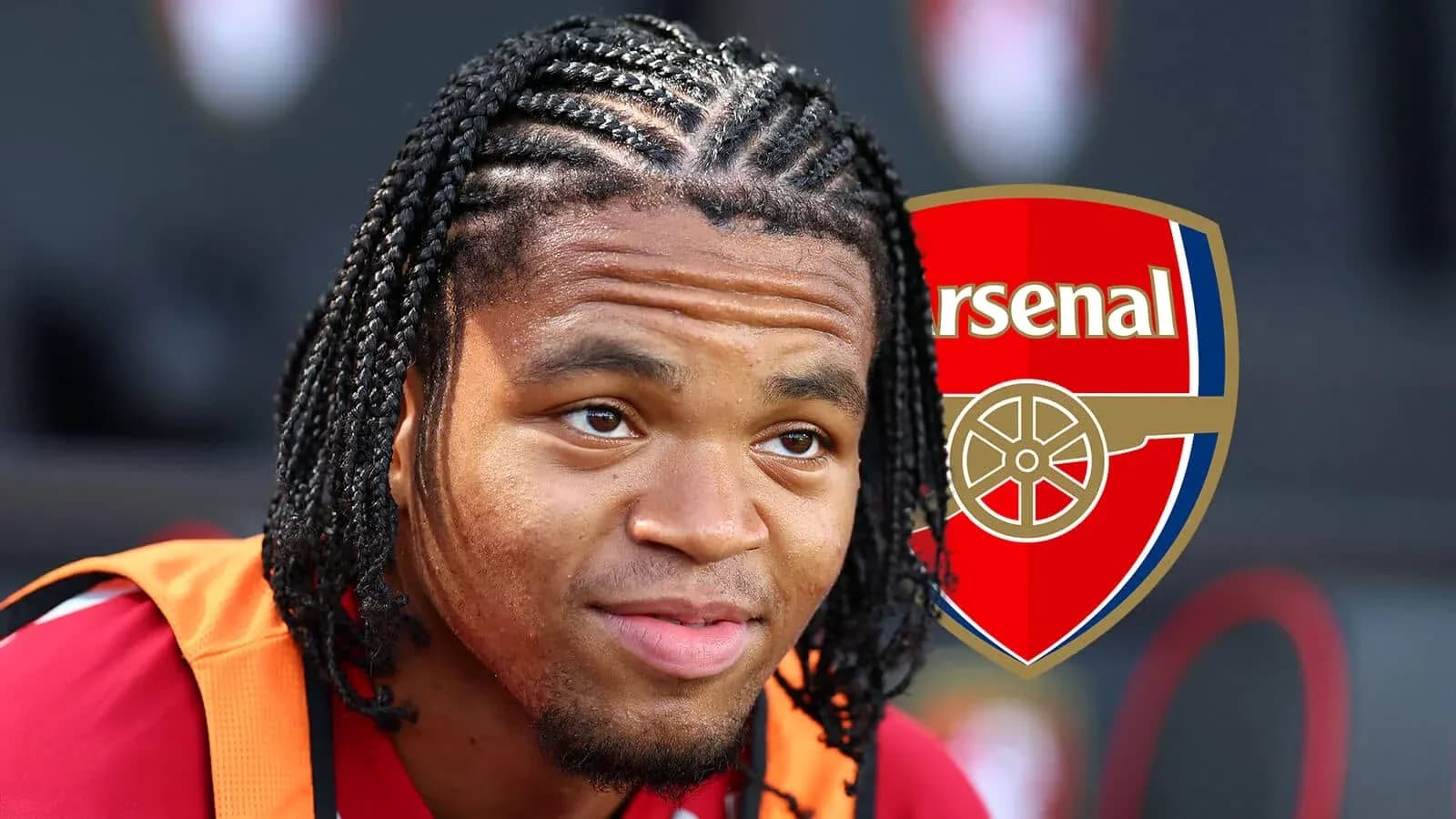 Player with braided hair in Arsenal jersey Player with braided hair in Arsenal jersey
