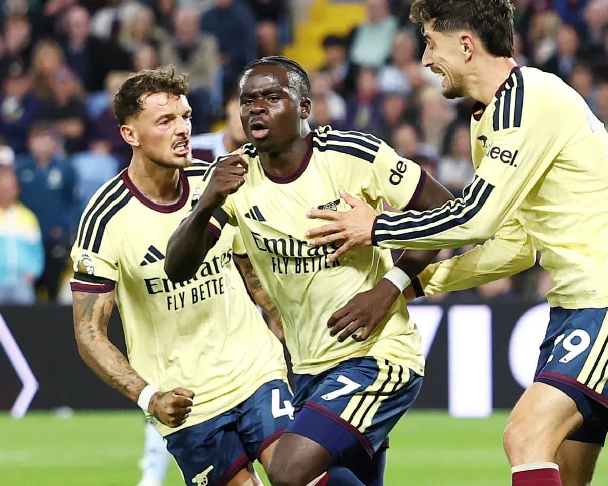 Arsenal players celebrating a goal during match Arsenal players celebrating a goal during match