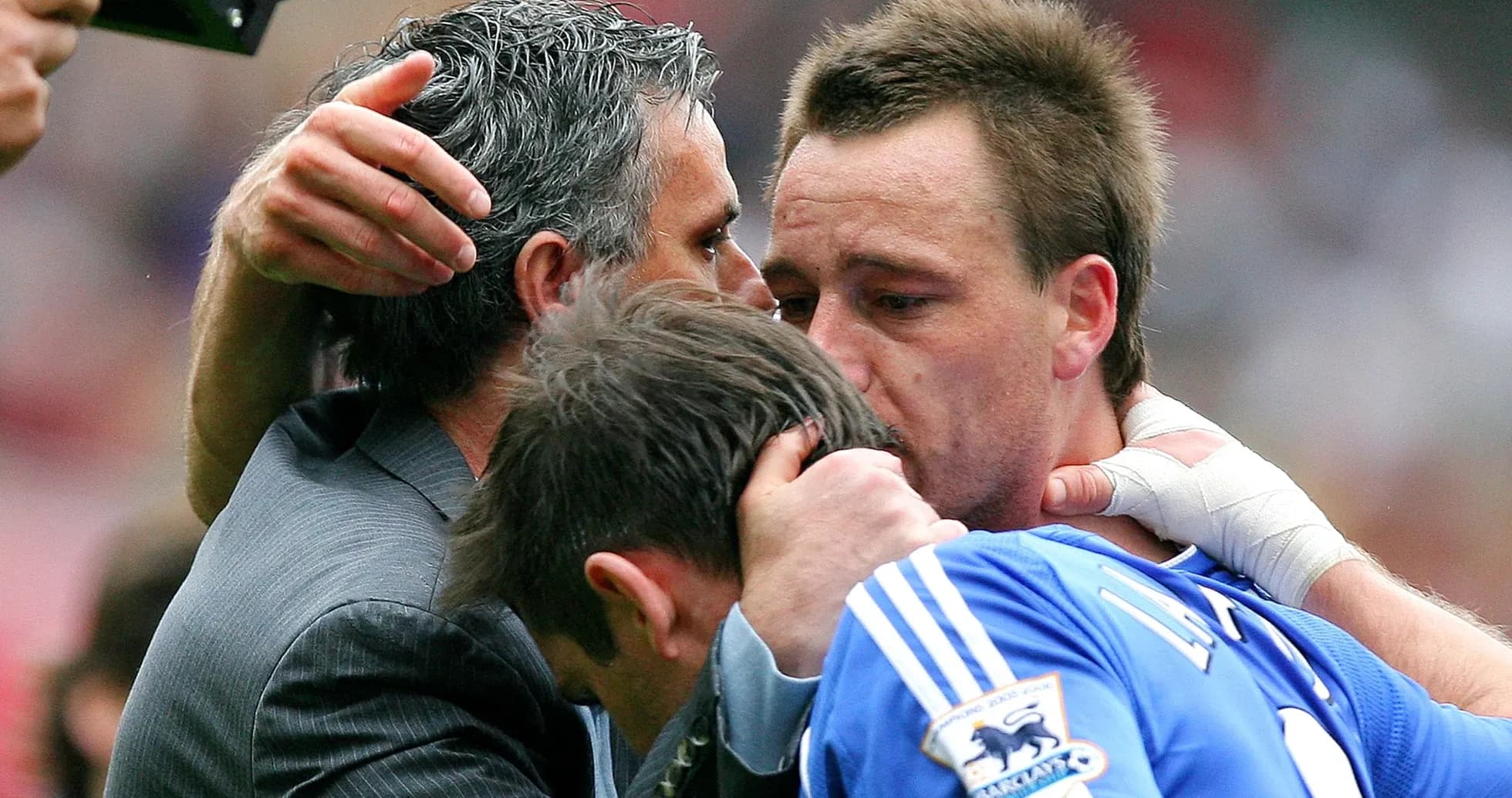 Players embracing during emotional moment after match Players embracing during emotional moment after match