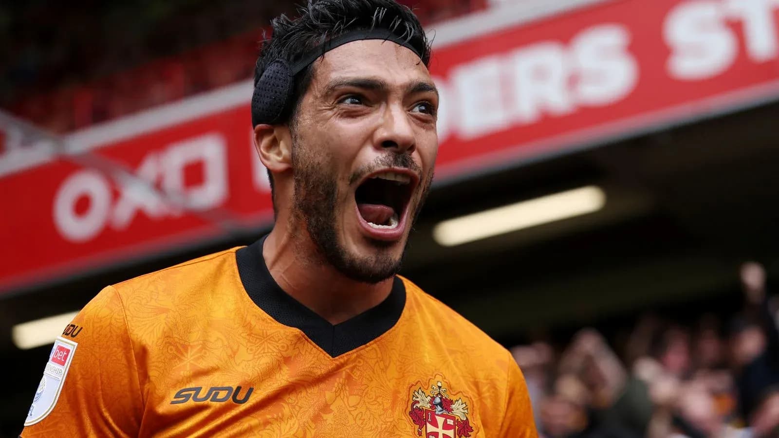 Player celebrating passionately after scoring a goal Player celebrating passionately after scoring a goal