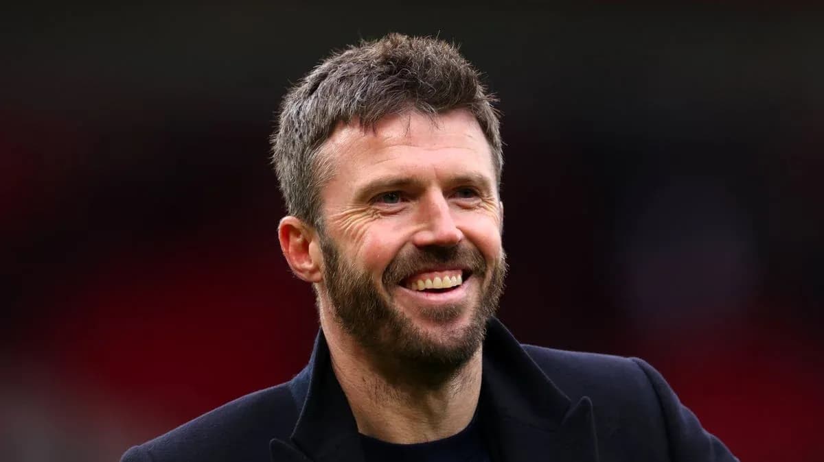 Man smiling in a dark jacket at stadium Man smiling in a dark jacket at stadium