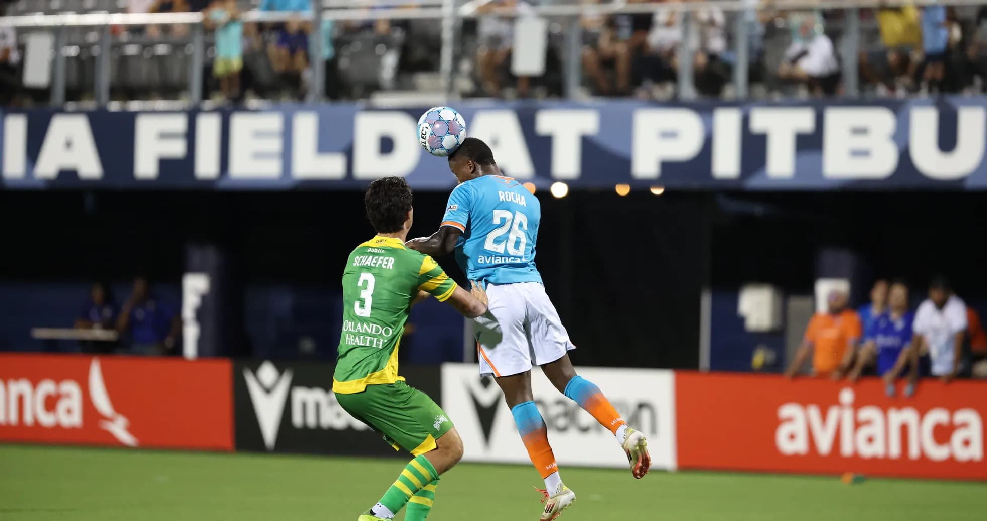 Player heading the ball during Miami FC match Player heading the ball during Miami FC match