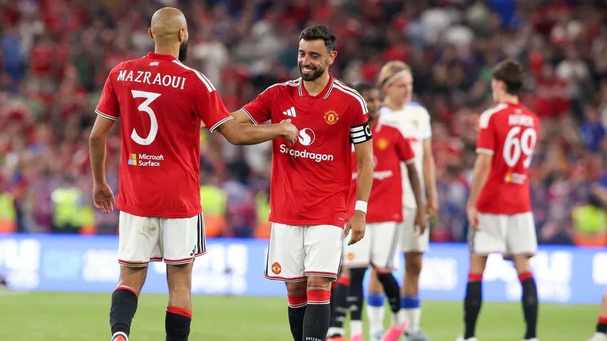 Bruno Fernandes and Mazraoui celebrating on the field Bruno Fernandes and Mazraoui celebrating on the field