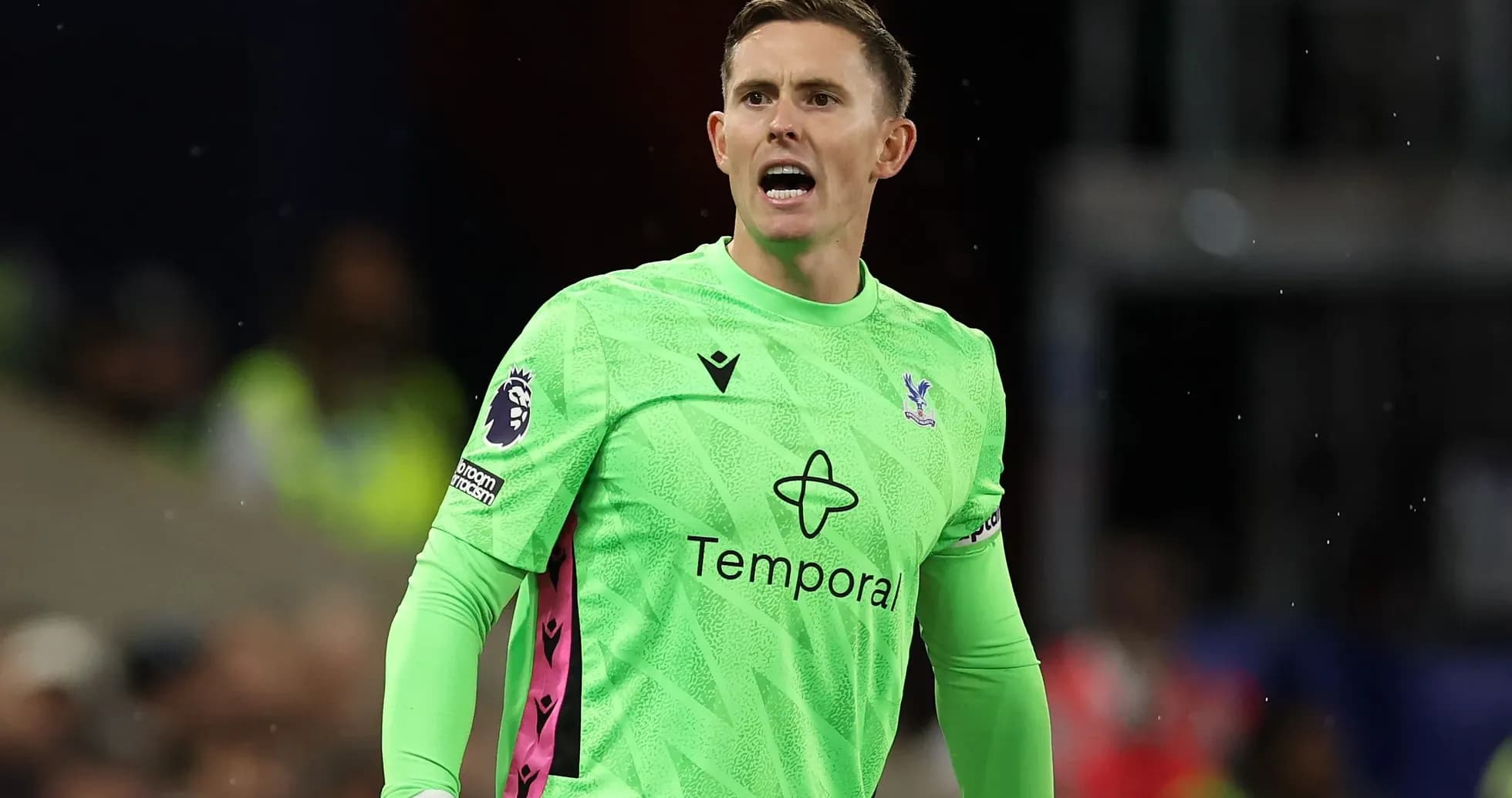 Goalkeeper in green kit shouting during match Goalkeeper in green kit shouting during match